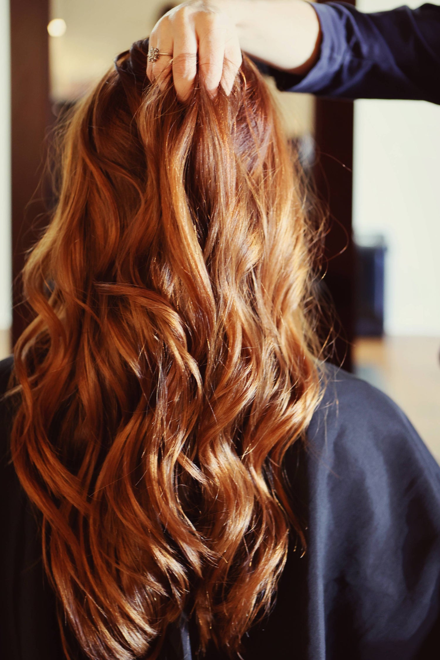 Salon client with dimensional hair color, foils, and highlights